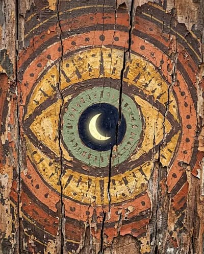 A close-up abstract and heavily textured image featuring a stylized eye with a luminous crescent moon nestled within its pupil,...