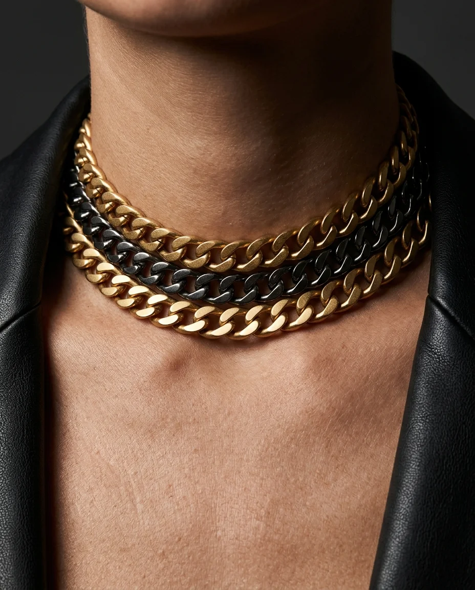 Extreme close-up fashion photograph focusing on the collarbone and neckline. The bold multi-strand chain choker fills the center of the...